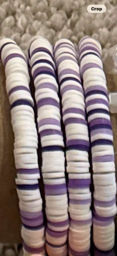 Lavender Cloud bracelet with mostly white beads and hints of purple