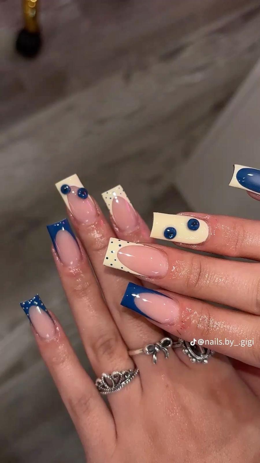 Medium design inspiration with blue dot French tips and 3D accents