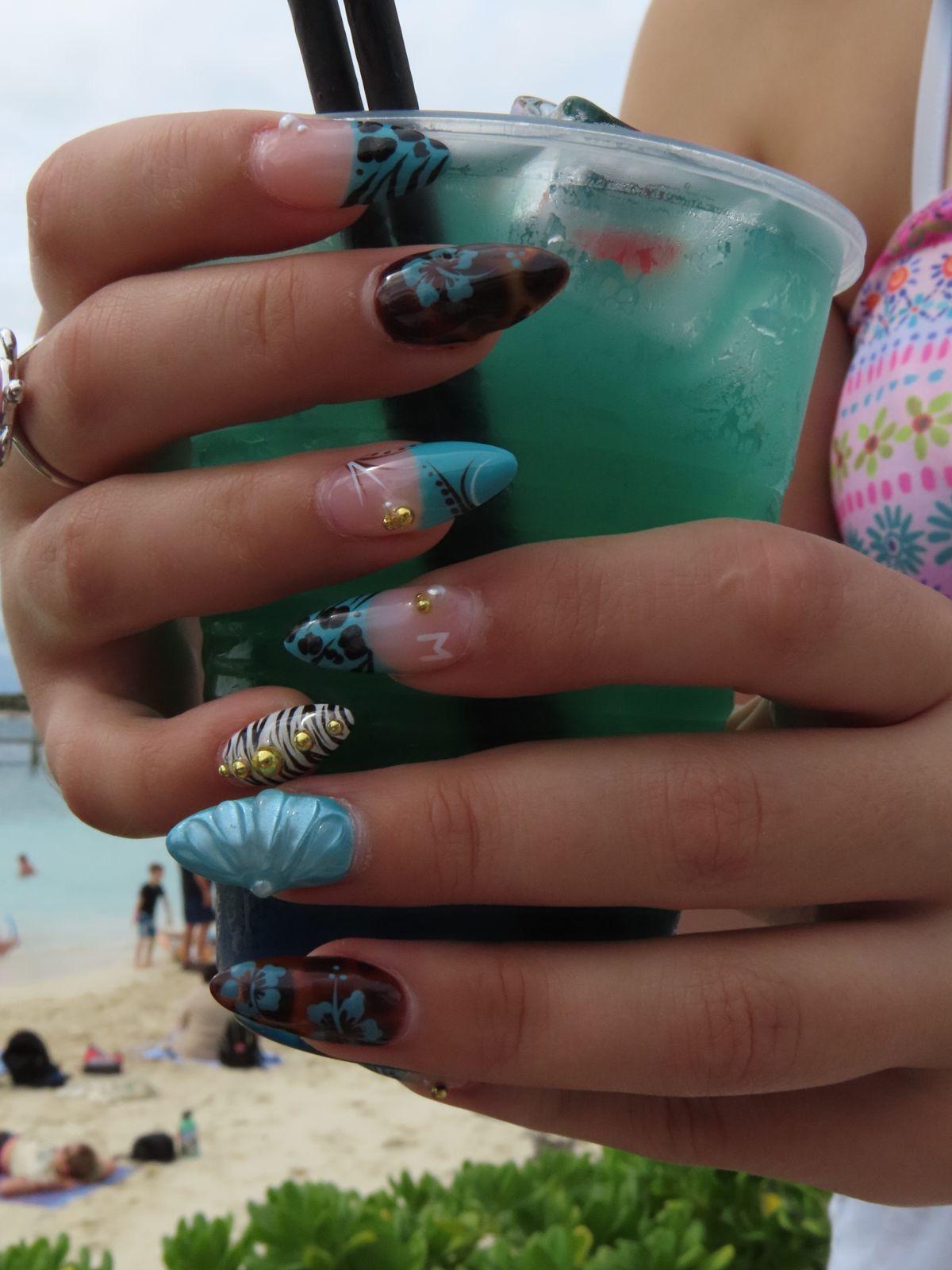 Medium design inspiration with turquoise, animal print, flowers, gold gems, and shell accent