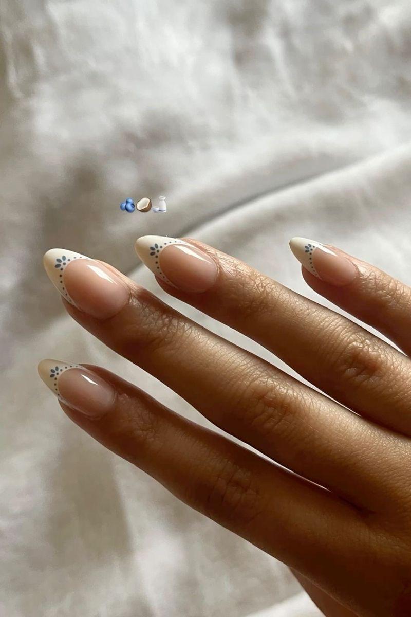 Simple design inspiration with pink French tips and small dot flowers